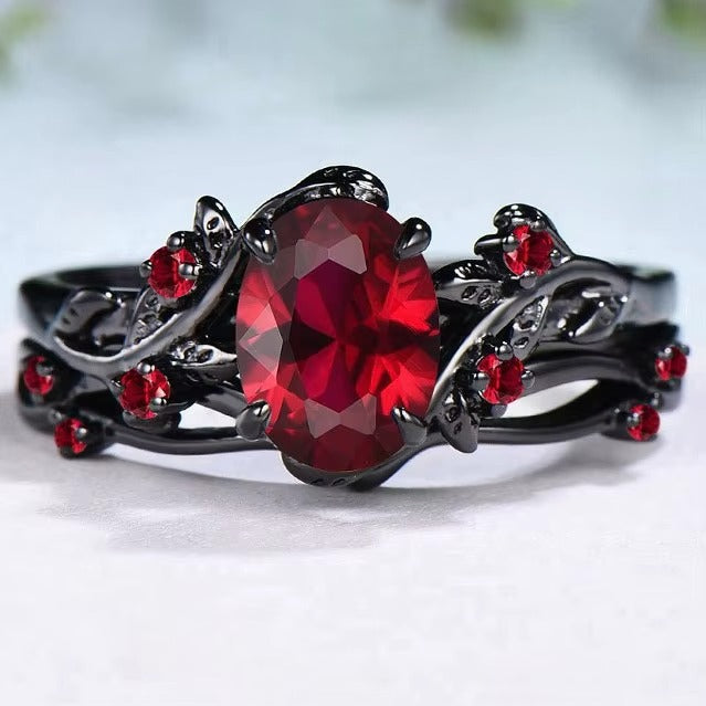Anello Fiore con Pietra Rossa e Dettagli Neri